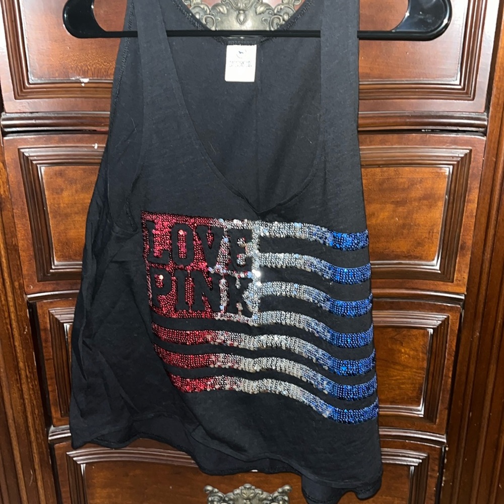 Like new Pink tank top size medium (runs big). Red, White and Blue shirt